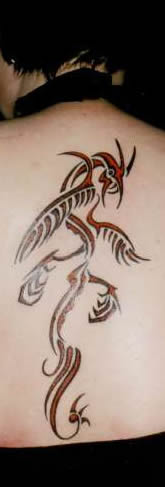 woman's back with tattoo of dragon